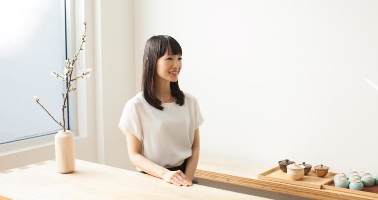 Marie Kondo sitting at a table