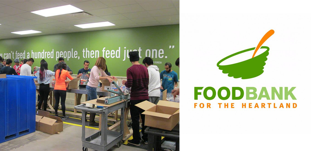 People loading boxes on an assembly line for Food Bank for the Heartland